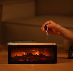 Aromatherapie ist beliebt: Tropfen Öl in den Kamin Duft Diffuser.